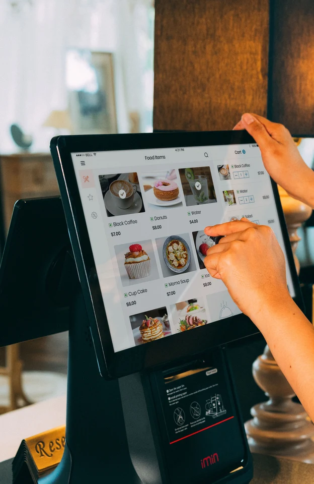 Staff taking an order on a delivery-kitchen POS screen