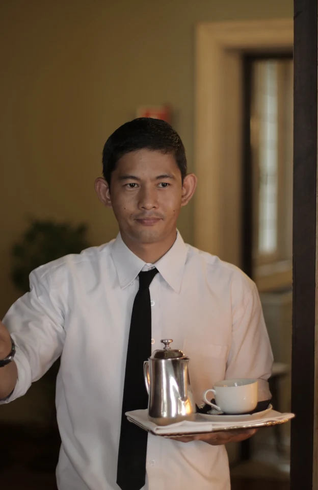 Room-service staff bringing an order to a guest room