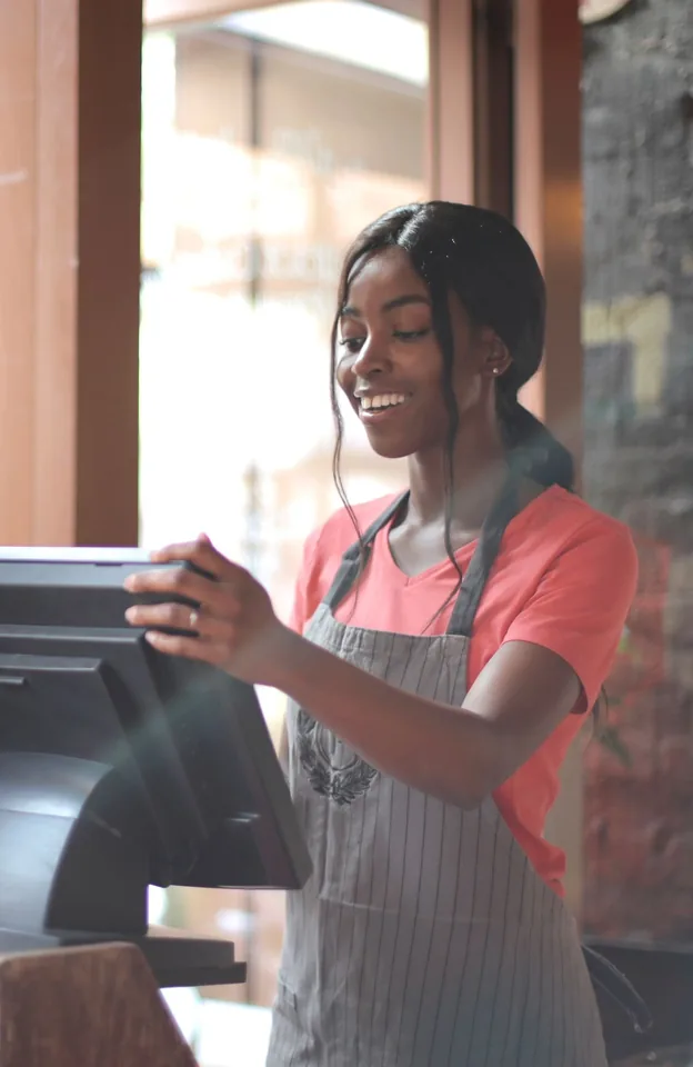 A restaurant cashier billing a table on the POS